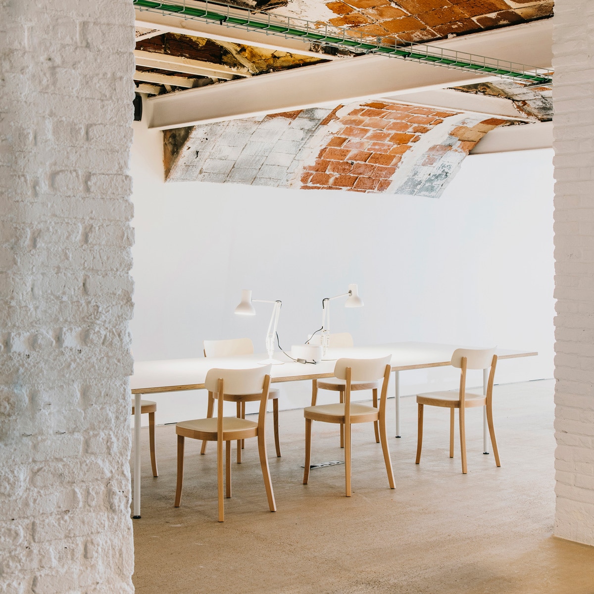 Montoya-Barcelona-long-table-exposed-brick