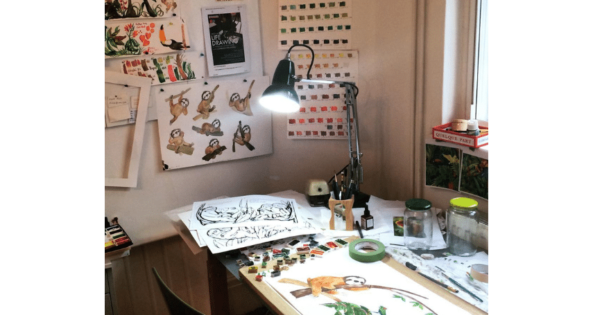 Anglepoise original 1227 desk lamp on artists desk sloths