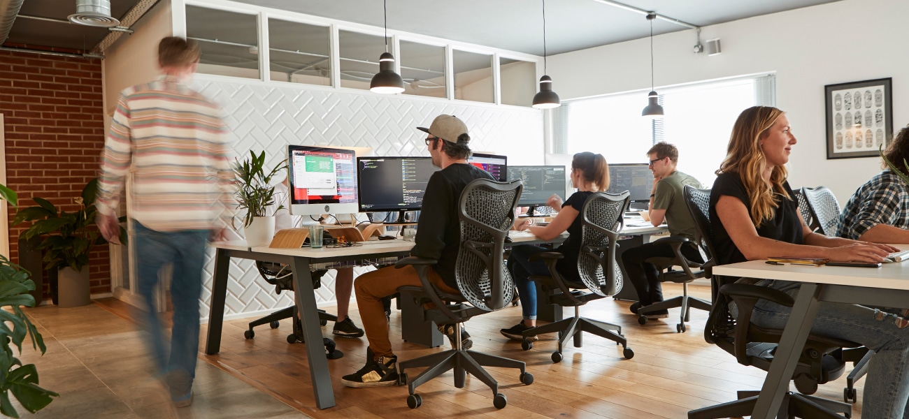 Superrb-Studio-team-members-at-desk